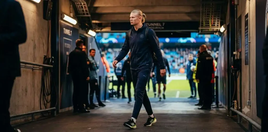 Footballer posing in stylish stadium setting