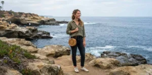 Traveler exploring the La Jolla Cove coastline